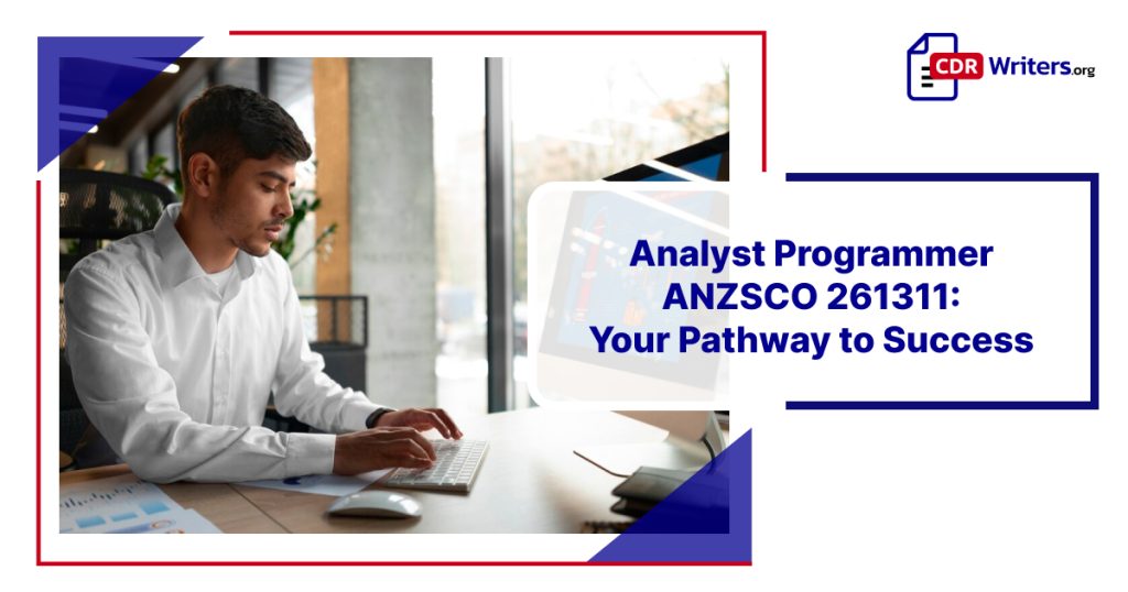 Young male analyst programmer ANZSCO 261311 working at a computer in a modern office environment, focusing on coding and data analysis.